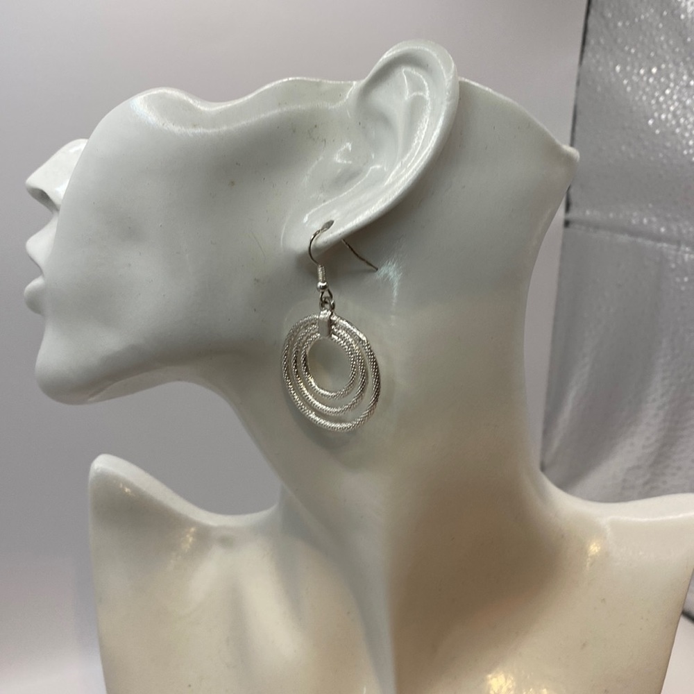 Lara silver tone triple hoops with beaded texture 1 and 3/4 length. Must have!